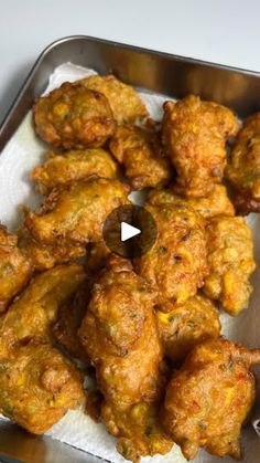 fried chicken wings in a metal pan on a table