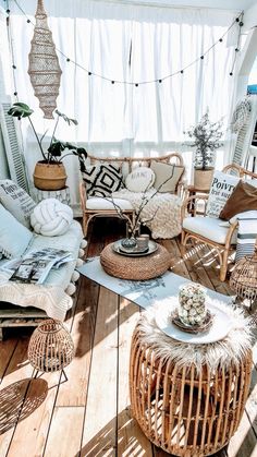 a living room filled with lots of furniture and decor on top of a wooden floor