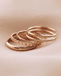 Don't know where to begin with our large selection of rings? We selected 5 dainty 14K gold filled rings to start your rings collection. Our starter set is the first step to building your jewelry collection. Set of 5 Rings 14K Gold Filled Size 4-10 Please note there are slight color variations or an appearance of a seam where the joints of the ring has been soldered. Due to their handmade nature, keep in mind that solder marks are visible and normal to have. If you would like. different sizes for Stacking Rings Gold, Dainty Rings, Layered Rings, Dainty Gold Rings, Stacking Ring Set, Casual Jewelry, Jewels Rings, 5 Rings, Golden Ring