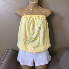 Beautiful Yellow Tie Halter Top Silver Foil Flowers Strapless Blouson Style Hidden Kangaroo Pocket Pouch In Front Perfect For Spring/Summer Bundle To Save Send Your Offers Yellow Halter Neck Tank Top For Summer, Fitted Yellow Tank Top For Beach Season, Yellow Halter Top For Spring Vacation, Casual Yellow Halter Neck Tank Top, Yellow Stretch Halter Neck Top, Yellow Stretch Halter Top For Vacation, Yellow Halter Neck Top For Beach, Yellow Halter Neck Tops For The Beach, Yellow Stretch Tank Top For Beach