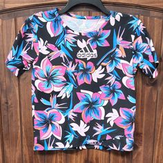 Nwt Bin L Adidas Multicolor Graphic Print Tops, Adidas Multicolor Short Sleeve Tops, Sporty Multicolor Adidas Tops, Adidas Sporty Multicolor Tops, Adidas Multicolor Graphic Print T-shirt, Adidas Multicolor Crew Neck T-shirt, Adidas Multicolor Casual Tops, Black Graphic Tee Shirt With Floral Print, Black Graphic Tee With Floral Print