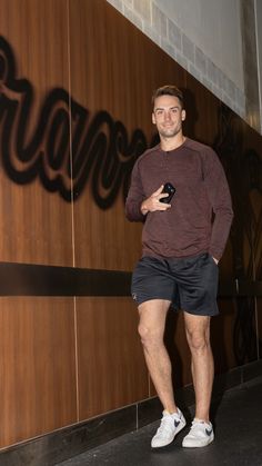 Matt Olson arrives at the clubhouse wearing a maroon long-sleeve tee, black shorts, and white Nikes. Matt Olsen Braves, 2024 Vision