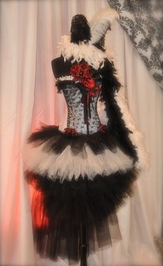 a mannequin dressed in black, white and red