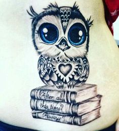 an owl is sitting on top of some books