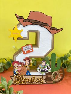 an image of the number two with cartoon characters on it