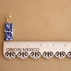 the ruler is next to an origami mexico design on it's side