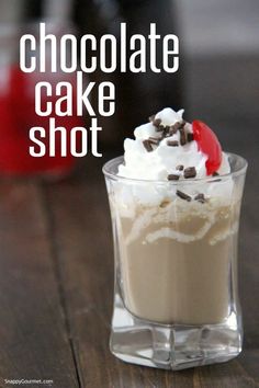 chocolate cake shot in a glass with whipped cream and chocolate shavings on top