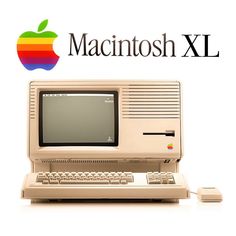 an apple computer sitting on top of a desk next to the macintosh xxl logo