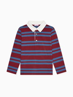 The Tijo Long Sleeve Boy Rugby Shirt has steadily become a staple in La Coqueta's collections, cut from responsibly sourced soft cotton jersey with a blue garment wash for a lived-in feel. Our idiosyncratic take on the classic rugby shirt has a vintage touch to it, complete with an appliquéd felt crest and the embroidered LC logo in contrasting thread for a collegiate, preppy look. It has long sleeves and dropped shoulders, with wide colour block stripes in light blue and burgundy red, a contrasting white collar, and a three-button fastening for a stylish and comfortable finish. Get the La Coqueta look this season and discover the wider range of boy’s clothing and shoes to elevate your little one’s everyday wear with versatile styles, and pair with La Coqueta's stretch cotton socks and tig Blue Cotton Tops With Ribbed Collar, Blue Cotton Top With Ribbed Collar, Fall Blue Cotton Polo Shirt, Cotton Long Sleeve Tops With Ribbed Collar, Long Sleeve Cotton Tops With Ribbed Collar, Blue Organic Cotton Long Sleeve Tops, Cotton Long Sleeve T-shirt With Ribbed Collar, Fall Cotton Crew Neck Polo Shirt, Navy Long Sleeve Cotton Polo Shirt