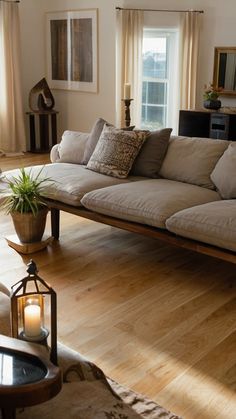 a living room filled with lots of furniture and decor on top of hard wood flooring