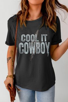 Black Cool It Cowboy Short Sleeve Graphic Tee Cool Black Crew Neck Top, Cool Black Top With Crew Neck, Cool Graphic Print Tops For Fall, Cool Black Top With Graphic Print, Cool Black Tops With Letter Print, Edgy Black Slogan Top, Black Edgy Slogan Top, Cool Short Sleeve Top With Text Print, Black Edgy Shirt With Text Print