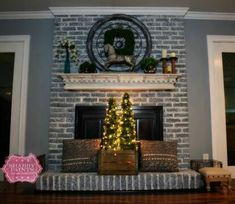 a christmas tree sitting on top of a couch in front of a fireplace