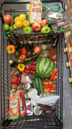 a shopping cart filled with fruits and vegetables