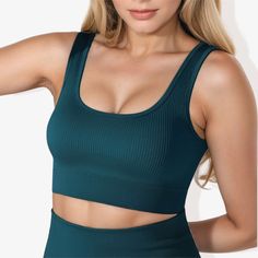 The Anna-Kaci Women's Scoop Neck Cropped Rib Knit Seamless Sports Bra is a stylish and versatile addition to your activewear collection. This sports bra features a scoop neckline and a cropped design for a contemporary look. The rib knit fabric ensures a comfortable, stretchy fit that moves with you. Its seamless construction provides a smooth, irritation-free experience during workouts. The scoop back and strap detailing add a unique and supportive touch, while the banded bottom offers extra st Cotton Sports Bra, Rib Knit Fabric, Strappy Sports Bras, Target Clothes, Seamless Sports Bra, Sewing Party, Active Women, Ulta Beauty, Modern Aesthetic