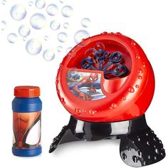 a spiderman bubble machine next to a bottle of water and an empty container with bubbles