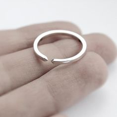 Handmade polished sterling silver ring. It's a simple band with a gap at the top flanked with two tiny pyramids. It can be a nice wedding band.Band Width: 1.5mmCan't find your size? Contact us for a custom order.A thicker oxidized version is available here: https://www.etsy.com/listing/195927320/two-close-double-pyramid-oxidized* Due to the open band design, size can be slightly adjusted.Visit my shop for the complete collection: http://www.etsy.com/shop/jewelryMirta© MIRTA Minimalist Couple Rings With Polished Finish, Minimalist Sterling Silver Couple Promise Rings, Minimalist Sterling Silver Promise Rings For Couples, Minimalist Silver Couple Rings For Promise, Silver Minimalist Initial Ring For Promise, Minimalist Stackable Sterling Silver Couple Rings, Minimalist Silver Initial Open Ring, Minimalist Sterling Silver Couple Rings With Simple Design, Simple Silver Open Ring