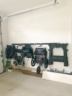 several different types of luggage hanging on a wall in a room with no one around