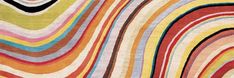 a multicolored rug with wavy lines on it