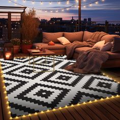 a living room with lights on the floor and a couch in front of a window