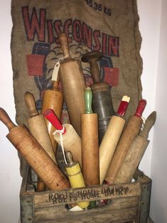 an old wooden box filled with lots of different types of wood shavings and other items