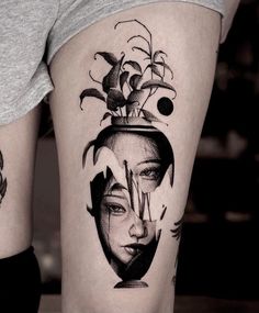 a woman's face is in a vase with flowers on her head and behind her are two other tattoos