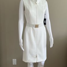 This Dress Has A Great Fit! Very Figure Flattering! Zipper Front In Gold With Gold Accent Belt. Elegant White Dress With Zipper Closure, Elegant White Dresses With Zipper Closure, White Sheath Dress With Back Zipper, White Tommy Hilfiger Dress For Work, Tommy Hilfiger White Dress For Work, Spring White Tommy Hilfiger Dress, White Lined Dress For Work, Lined White Dresses For Work, Argyle Sweater Dress