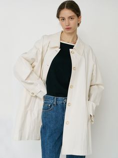 Soft and drapery, this trench coat features relaxed silhouette with classic collar detail and single breasted button fastenings. Raglan sleeves and deep tucks add to the natural yet stylish mood. - Crisp cotton and nylon blend- Semi loose fit in half length- Gold-trimmed button detail through front and at cuffs- Wide back flap detail- Mini matte logo charm at back Timeless Spring Outerwear With Button Closure, Classic Spring Outerwear With Covered Buttons, Spring Cream Outerwear With Covered Buttons, Button Detail, Raglan Sleeve, Fit In, Single Breasted, The Natural, Trench Coat