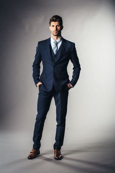 This premium corporate blue suit is a power suit. Walk into any meeting, interview, or event and you will look and feel like a boss! This fabric exudes sophistication and has a very voguish style. Great suit year round. Like this look, but want to make some changes? Chat with a stylist or book an appointment. Color: Navy Blue Pattern: Plain Composition: 100% Wool Yarn Count: SUPER 130S Weight: 265 G/SM Occasion: Formal Suit/Casual Blue Three-piece Wedding Suit In Suiting Fabric, Blue Three-piece Wedding Suit, Blue Wedding Blazer In Suiting Fabric, Custom Fit Blue Tuxedo For Groom, Fitted Royal Blue Tuxedo Suit, Fitted Blue Three-piece Suit With Pressed Crease, Groom's Three-piece Suit With Pressed Crease, Tailored Blue Tuxedo For Groom, Blue Notch Lapel Tuxedo For Wedding