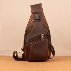 Crazy Horse Leather Chest Bag for Men's Leisure Retro Style Crossbody Bag Top Layer Cowhide Shoulder Bag Commuter Outdoor Leisure Bag PRODUCT INFORMATION --------------------------------------------- --Product Size: 34x9x17 cm--13.38x6.69x3.54 inch; --Item Weight:0.6 kg/1.32lb --Color: Deep Brown --High-Quality Stitching This bag has an adjustable shoulder strap. On the back of the crossbody bag are two hooks for both the left and right shoulders The ultimate grab-and-go daypack, this brown leather crossbody bag is built to be an upgrade on overstuffed pockets. It's made from genuine full grain buffalo leather, the highest grade available. That means the very top layer of the hide only is used. Buffalo leather is the strongest and thickest type available. This gives it the longest durabili Brown Satchel Chest Bag For Outdoor, Outdoor Brown Bag With Anti-theft Pocket, Brown Outdoor Bags With Anti-theft Pocket, Outdoor Large Capacity Brown Chest Bag, Brown Outdoor Shoulder Bag With Anti-theft Pocket, Brown Shoulder Bag With Anti-theft Pocket For Outdoor, Brown Crossbody Chest Bag For Outdoor, Brown Chest Bag With Zipper For Outdoor, Brown Chest Bag With Zipper Pocket For Outdoor