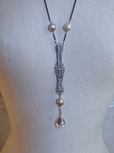 This necklace is made from a gorgeous Art Deco sterling silver and rhinestone brooch. I removed the sharp pin and mechanism, and set it in silver tone wire, with black oxidized chain, and champagne colored baroque pearls. Hanging from the bottom is another pearl and a polished quartz drop set in sterling silver. This gorgeous piece balances the elegance of the era with the raw beauty in the aesthetic concept of wabi sabi...the materials are antiqued and distressed, only adding to the depth of th Silver Wrapping Paper, Raw Beauty, Black Crochet, Champagne Color, Gorgeous Art, Rhinestone Brooches, Vintage Rhinestone, Unique Necklaces, Baroque Pearls