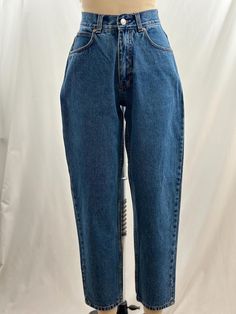 These 90s Cabela's jeans are the basic denim you need.  High waisted, they have a slight tapered leg with a mom fit and a medium wash.  Pair with a blazer and oxford shoe. -Vintage 90s -Medium wash, high waist -Machine wash recommended  Measurements: *Waist 12 1/2 inches *Rise 11 1/4 inches *Hips 17 1/2 inches *Inseam 27 1/2 inches *Length 37 1/2 inches *This item is pre-loved and there may be minor flaws to the garment. Not to worry if there is anything major we will let you know. --Please read shop policies thoroughly relating to sizing, returns will not be accepted. I encourage you to ask questions for additional pictures, measurements, etc.-- Oxford Shoe, 90s Jeans, Jeans High Waisted, Jeans Mom, Medium Wash Jeans, Washed Jeans, Wash Jeans, High Waisted Denim, High Jeans