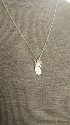 "Cute little flip flop Lop bunny pendant necklace. The Lop rabbit charm necklace is hand made with love from solid .925 Anti Tarnish sterling silver. You can add It has a tiny heart dangle on the chain plain or add an initial. Pendant Size ~ 7/8\" (21mm) W x 5/8\" (15mm) H Necklace Length ~ available in 16\", 18\", 20\" & 24\" Material ~ All Sterling silver, 925 Mixed breed? want YOUR pet? check out my custom silhouette TaGette necklaces https://www.etsy.com/shop/DiBAdog?section_id=15431427 Silver Bunny Design Jewelry For Gifts, Silver Bunny Design Jewelry Gift, Silver Jewelry With Bunny Design For Gift, Rabbit Necklace, Bunny Paws, Bunny Necklace, Rabbit Charm, Rabbit Necklaces, Personalized Pendant