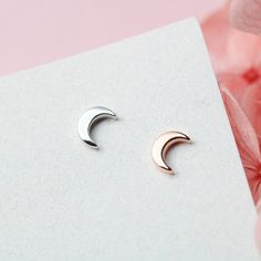 This pair of tiny crescent moon stud earrings is made of authentic 925 sterling silver, highly polished for a great shine. Experience the subtle elegance and beauty of these tiny sterling silver moon stud earrings, handcrafted from 925 sterling silver and polished to perfection. Each pair is a stunning addition to any outfit, adding a touch of celestial charm that will draw compliments and elevate your style. With their high-quality construction and brilliant shine, these earrings are a must-hav Silver Crescent Cartilage Earrings With Moon Charm, Minimalist Silver Moon Phase Earrings, Crescent Sterling Silver Cartilage Earrings As Gift, Silver Minimalist Moon Cartilage Earrings, Sterling Silver Cartilage Earrings With Moon Charm For Gift, Sterling Silver Crescent Cartilage Earrings With Moon Charm, Minimalist Rose Gold Sterling Silver Ear Climbers, Elegant Crescent Silver Cartilage Earrings, Elegant Silver Crescent Cartilage Earrings