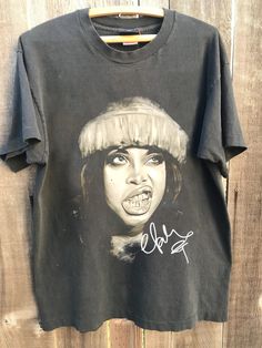 Erykah Badu Tour 2024 Tshirt, Erykah Badu vintage, music t-shirt Gift for men, women Unisex T shirt Comfort color ABOUT MATERIAL: Comfort Colors® 1717 Made with medium fabric (6.1 oz/yd² (206.8 g/m consiting of high quality, 100% ring-spun US cotton for long-lasting comfort. The relaxed fit keeps the wearer comfy in both casual and semi-formal settings while the crew neckline delivers that classic, neat style which makes it perfect for accessorizing. What's more, the pre-shrunk fabric ensures a Band Merch Tops With Vintage Print And Short Sleeves, 90s Vintage Print Black T-shirt, Vintage Short Sleeve T-shirt For Music Festivals, Vintage Sublimation Print T-shirt For Streetwear, Vintage T-shirt With Sublimation Print For Streetwear, Band Merch T-shirt With Vintage Print, Band Merch Short Sleeve T-shirt With Vintage Print, Unisex Vintage Crew Neck T-shirt, Grunge Style Short Sleeve T-shirt For Music Festivals