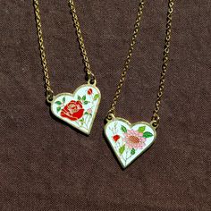 "This necklace is 17\" long and features a 20mm vintage enamel floral charm pendant. Necklace chain is gold plated stainless steel and tarnish resistant. Charm is gold plated, however due to vintage nature, gold karat is unknown. Some may have mild tarnishing on back due to age.  Please select your desired style from the drop down box." Enamel Necklaces For Anniversary On Valentine's Day, Valentine's Day Gift Enamel Charm Necklaces, Valentine's Day Gift Enamel Charm Necklace, Vintage Flower Charm Jewelry For Valentine's Day, Vintage Jewelry With Flower Charm For Valentine's Day, Vintage Nickel-free Charm Necklace For Valentine's Day, Vintage White Necklace For Valentine's Day, Vintage Heart Enamel Necklaces, Vintage Enamel Heart Necklaces