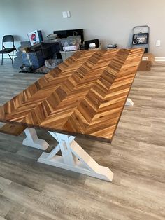 a wooden table sitting on top of a hard wood floor