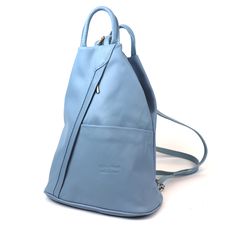 Features: Measurements: 31cm x 26cm x 13cm Handmade from Genuine Italian Leather Front Zip and Slip Pockets Back Zip Pocket Inside Zip Pocket Silver Zipper Adjustable Straps - Can be worn as a Sling Bag Adaptable Elegance: This backpack offers you the freedom to wear it your way. Carry it as a sling bag or the classic backpack - it effortlessly adjusts to your needs and mood. Smartly Organised: With inside zip pocket your essentials remain neatly organised. Plus, the front and back zip pockets and front slip pocket add extra space for quick access to your belongings. Your Choice of Shade: With a spectrum of captivating colours, you can express your individuality and match your bag to your outfit. From bold and vibrant to timeless and classic, there's a shade for every style. Built to Last: Modern Blue Leather Backpack For Travel, Everyday Light Blue Backpack, Blue Leather Travel Backpack, Modern Blue Leather Backpack For Everyday, Modern Blue Leather Travel Backpack, Blue Rectangular Leather Backpack For Travel, Light Blue Travel Backpack, Modern Everyday Blue Leather Backpack, Casual Blue Leather Backpack