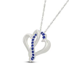 Two hearts collide in the prettiest way in this sweet and shimmering necklace. Sterling silver Two open hearts are entwined in the polished pendant Along the center, a curved ribbon of round blue lab-created sapphires shines 18-inch rope chain; spring ring clasp Sapphire Heart Necklaces For Anniversary, Sapphire Heart Necklace For Anniversary, Heart-shaped Sapphire Necklace For Anniversary, Elegant Sapphire Heart Pendant Necklace, Elegant Sapphire Necklaces For Valentine's Day, Sapphire Heart Pendant Jewelry For Valentine's Day, Sapphire Heart Pendant For Anniversary, Blue Open Heart Jewelry For Anniversary, Blue Heart Pendant Necklace For Anniversary