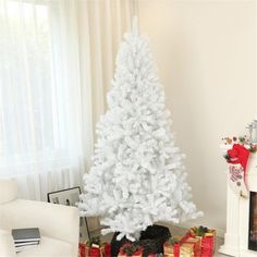 a white christmas tree with presents under it