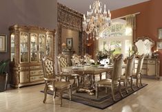 a dining room table with chairs and a chandelier