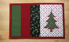 a quilted placemat with a christmas tree on it and polka dots around the edges