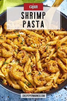 a skillet filled with shrimp pasta and topped with parmesan cheese on top