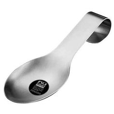 a spoon with a black and white label on the side, sitting in front of a white background