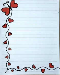 a sheet of lined paper with red hearts and a butterfly on the corner, in front of