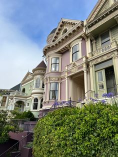 some very pretty houses by the bushes and stairs