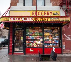 a grocery store on the corner of a city street