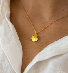 The sweet miniature locket medallion necklace is a great addition to your collection and also makes a memorable gift for someone. This charming piece is handcrafted with care to ensure that every detail is unique.  -Made with high-quality brass dipped in 14k gold, it is delicate and dainty, but makes a statement alone or layered with other necklaces.  -The locket is designed to hold your most cherished memories close to your heart, making it a perfect gift for someone special in your life.  -The locket medallion necklace is 16" with a 2-inch extension chain. -All our jewelry comes beautifully and safely packed in a gift box. You can include a gift message. Receipt is not included in the package. Dainty Gold Plated Pendant Locket Necklace, Dainty Gold-plated Locket Necklace, Gold Locket Necklace In Brass, Gold Brass Locket Necklace, Dainty Gold Plated Locket Necklace Gift, Dainty Yellow Gold Pendant Locket Necklace, Yellow Gold Brass Charm Necklaces With Oval Pendant, Gold Pendant Locket Necklace With Delicate Chain, Gold Plated Locket Necklace Amulet Style