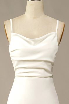 a white dress on a mannequin neckline with an open back and straps