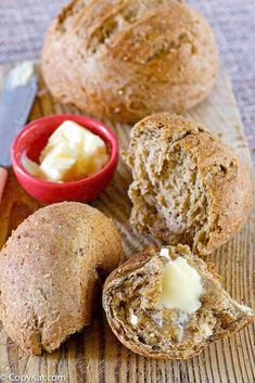 some bread and butter on a wooden table