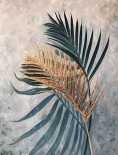 a painting of a palm leaf on a gray background with gold foiled leaves in the foreground